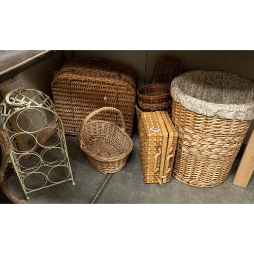 2681 - A selection of Wicker baskets including linen, Picnic etc & A wrought iron bottle stand