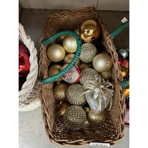 2689 - A quantity of Christmas baubles. ( 2 Wicker baskets & A shoe box)