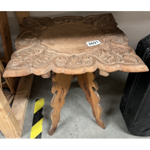 2691 - A carved wood side table