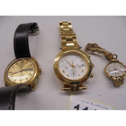 1111 - A Garrard date watch, a ladies Everite Junior watch and one other.