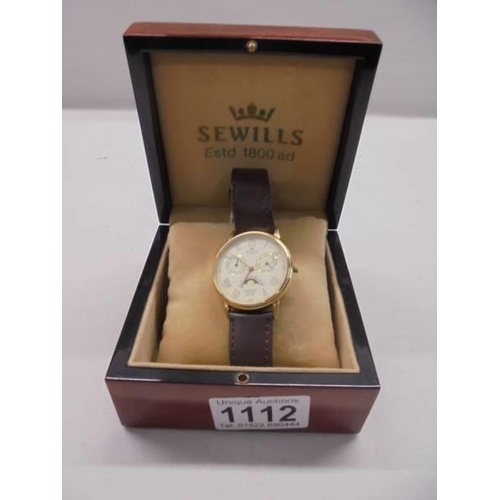 1112 - A cased 14ct gold Sewills Millenium watch.