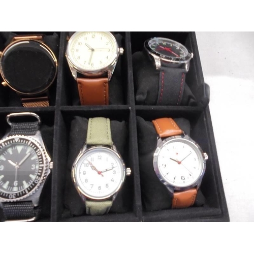 1113 - A case of twenty assorted gent's watches, some working (case lid damaged).