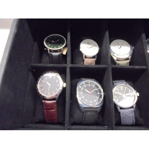 1113 - A case of twenty assorted gent's watches, some working (case lid damaged).