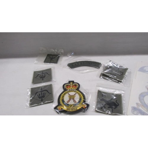 1124 - A quantity of cloth badges and patches etc.,