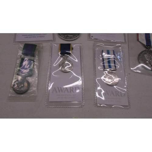 1130 - Four award medals including 65th anniversary and sapphire jubille and three miniature medals.