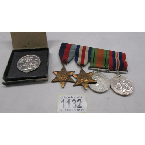 1132 - A set of WW2 medals and a Festival of Britain coin.