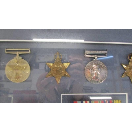 1135 - A framed and glazed cased medal display from Lesley Lorking including Africa General Service medal w... 