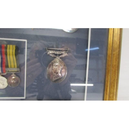 1135 - A framed and glazed cased medal display from Lesley Lorking including Africa General Service medal w... 