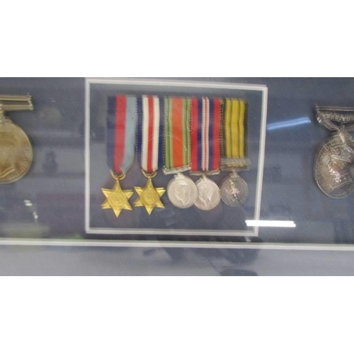 1135 - A framed and glazed cased medal display from Lesley Lorking including Africa General Service medal w... 