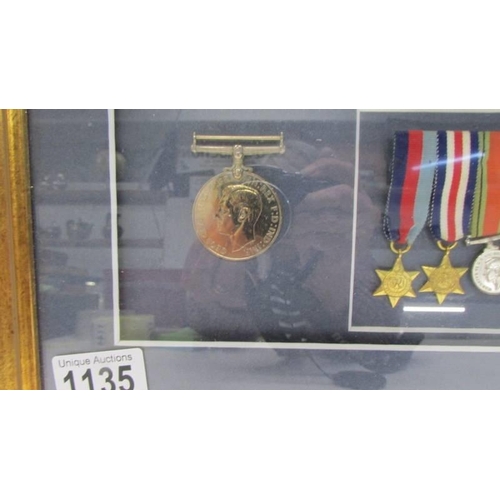 1135 - A framed and glazed cased medal display from Lesley Lorking including Africa General Service medal w... 