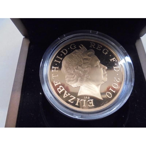 1140 - A cased 2010 Restoration of the Monarchy gold proof £5 coin, 22 carat, 36.6 grams.