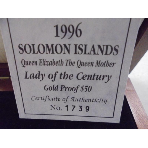 1141 - A cased 1996 Solomon Islands Queen Elizabeth The Queen Mother 'Lady of the century' gold coin, 14 ca... 