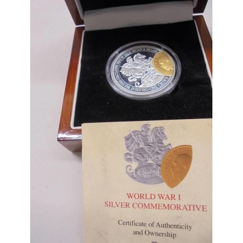 1147 - A WW1 silver commemorative St. George coin in case, a 2005 Cook Islands silver Trafalgar coin & 1998... 