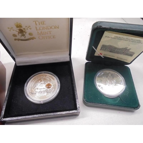 1147 - A WW1 silver commemorative St. George coin in case, a 2005 Cook Islands silver Trafalgar coin & 1998... 