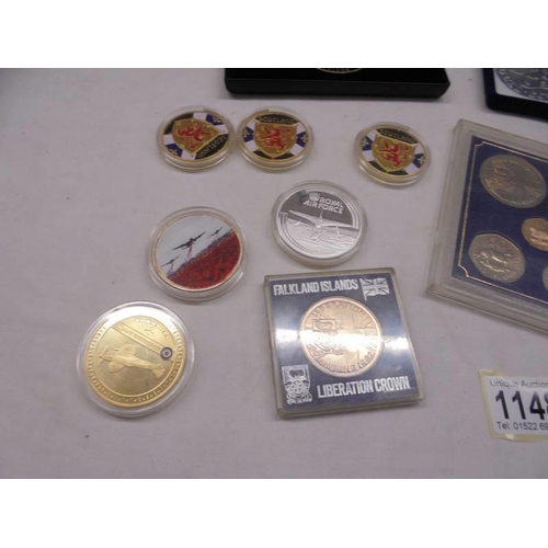 1148 - A mixed lot of collector's coins including Falkland Islands, cases set of 'V Force' etc.,