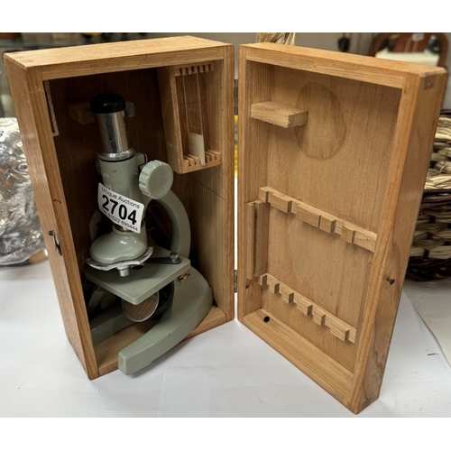 2704 - A childs mirrored microscope in a wooden box