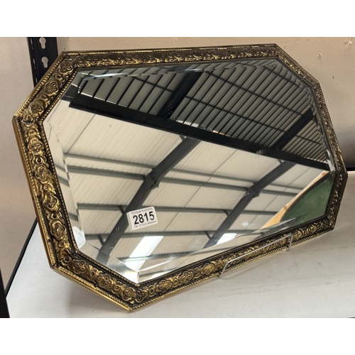 2815 - A vintage brass framed bevel edge mirror