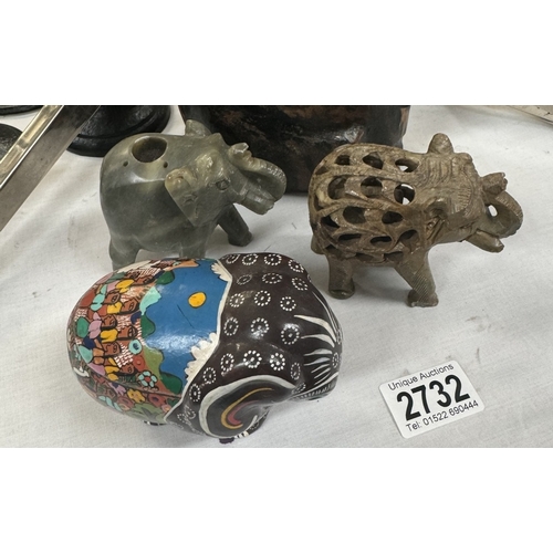 2732 - A carved wooden elephant & 3 others