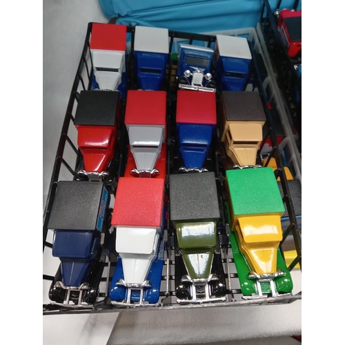 2889 - A Matchbox carry case with 48 MB38 model A Ford vans & 32 empty boxes. In mint condition