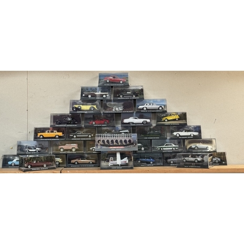 43 - A collection of 111 James Bond collectors cars & magazines