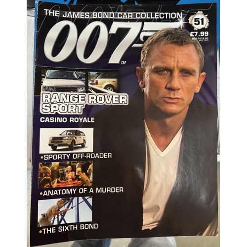 43 - A collection of 111 James Bond collectors cars & magazines