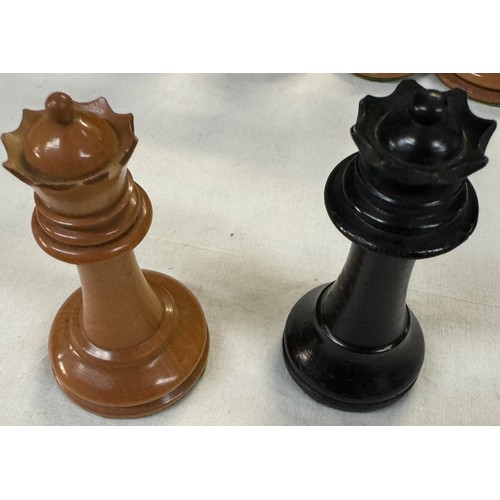 2718 - A weighted wood chess set, A smaller chess board & A vintage boxed wood skittle set