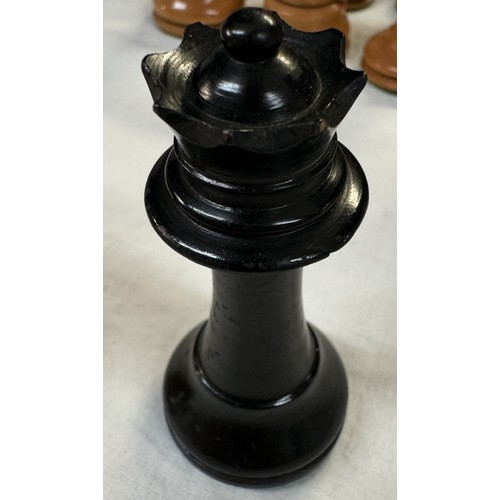 2718 - A weighted wood chess set, A smaller chess board & A vintage boxed wood skittle set