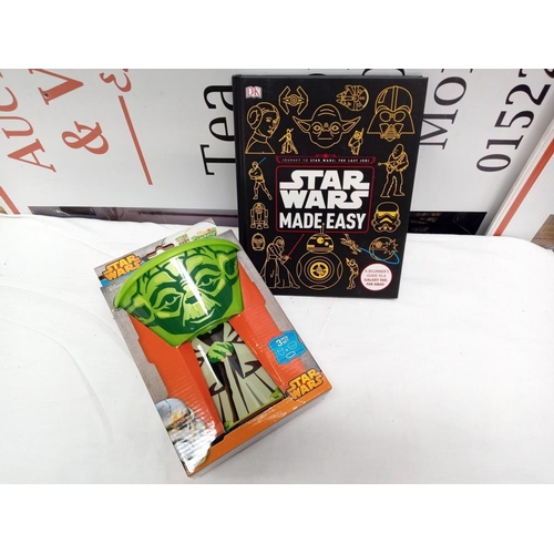 61 - A quantity of new Star Wars items including mugs, meal set & book etc.