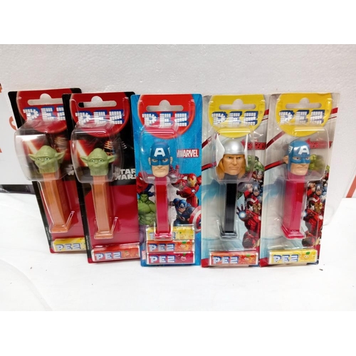 64 - 11 unopened packets of PEZ (for collectors only as sweets are out of date)