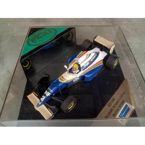 70 - 5 boxed Heritage racing cars, Schumacher x2, Ayrton Senna, David Coulthard & Nigel Mansell