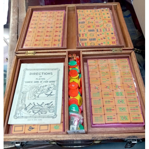 75 - A beautiful carved box comprising of a mahjong set