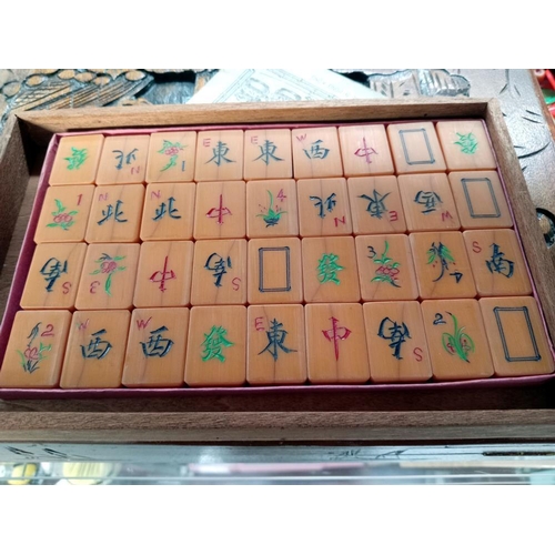 75 - A beautiful carved box comprising of a mahjong set