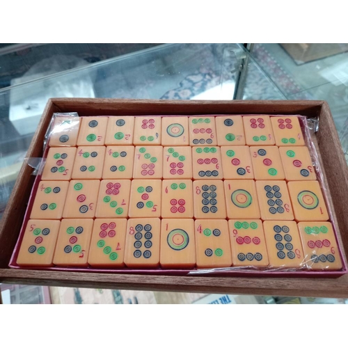 75 - A beautiful carved box comprising of a mahjong set