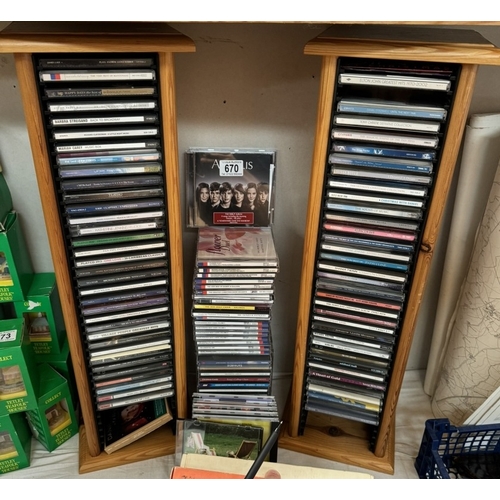 670 - A quantity of CD's on 2 storage shelves