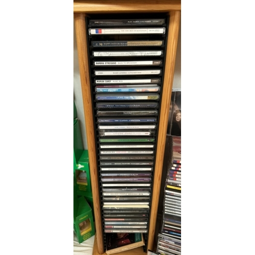 670 - A quantity of CD's on 2 storage shelves