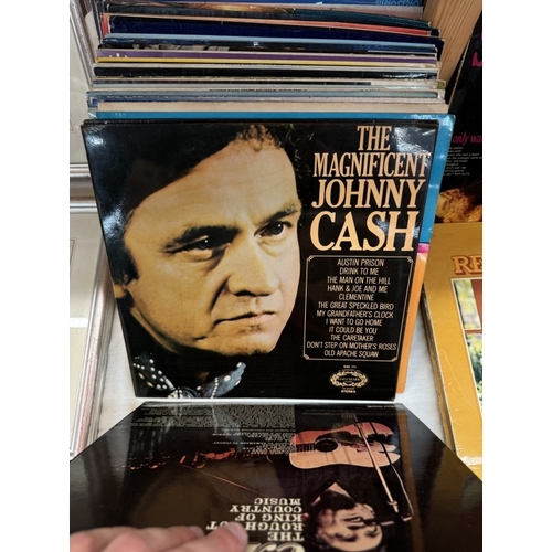 681 - A quantity of records including Johnny Cash, Glen Miller & Arlo Guthrie etc.