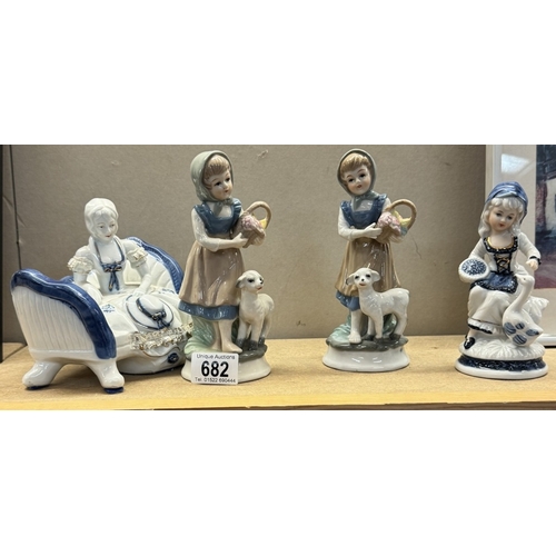 682 - 4 blue & white china figures of girls & lambs etc.