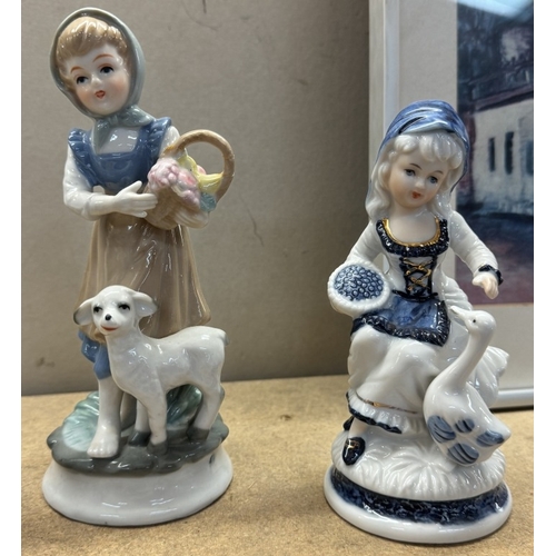 682 - 4 blue & white china figures of girls & lambs etc.