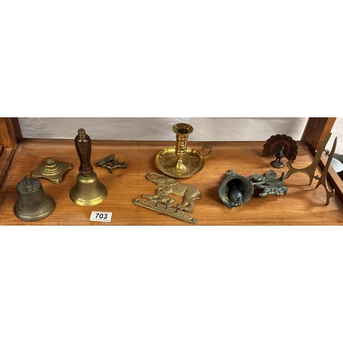 703 - A selection of brass including bells & chamber candlestick etc.