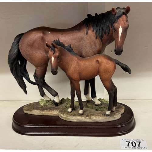 707 - A horse and foal figure on base.