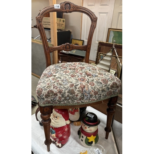 714 - An Edwardian carved mahogany chair with tapestry top