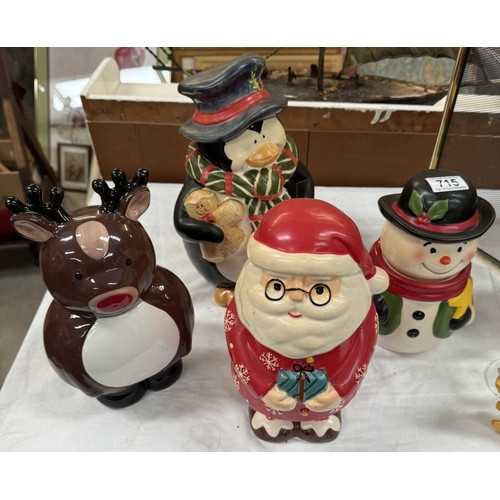 715 - 4 pottery Christmas themed sweet/biscuit containers