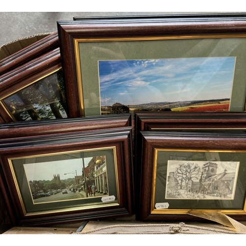 745 - A box of framed pictures