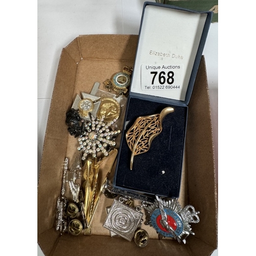 768 - A collection of pin badges & brooches including fire service, air fire department & RAF air support ... 