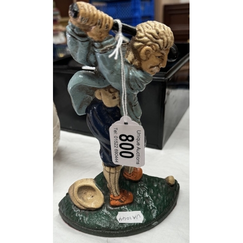 800 - A golfing cast door stop