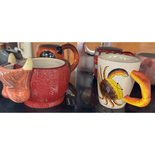 818 - A quantity of character mugs