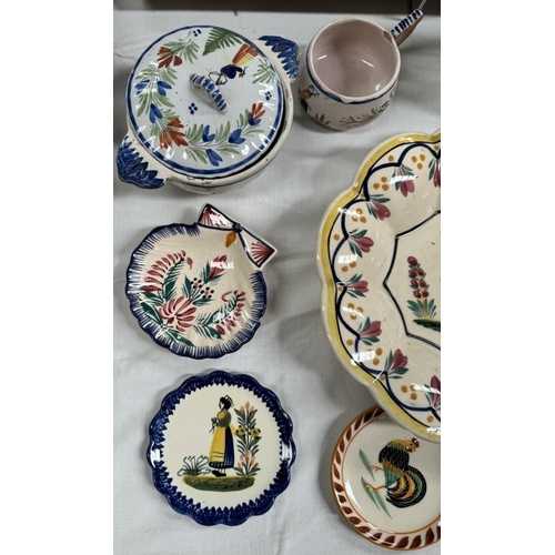 828 - A collection of Quimper ware, mostly A/F