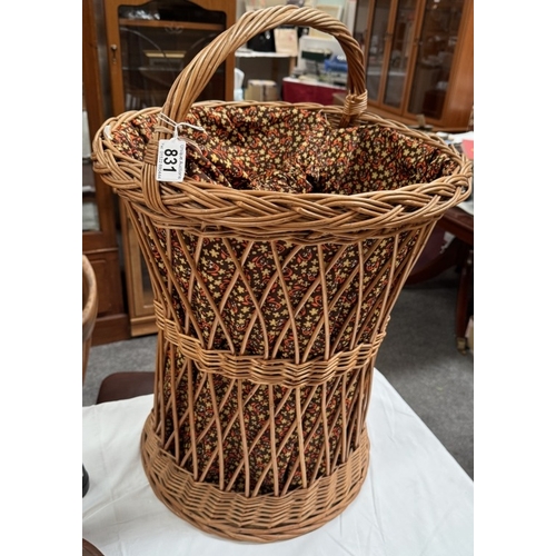 831 - A good wicker laundry basket with floral fabric liner