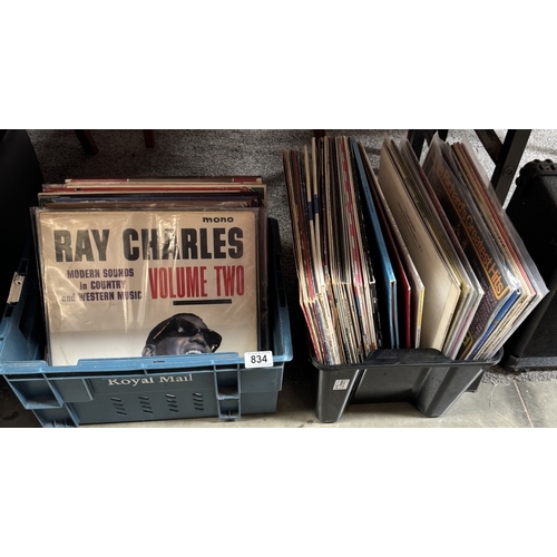 834 - 2 boxes of mixed LP records including Ray Charles, Steve Hackett & Human League etc.