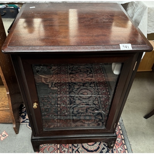 841 - A dark wood music cabinet with bevelled glass door